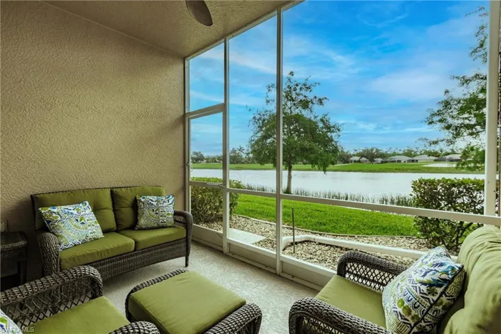 Sunroom with a water view