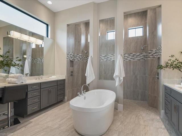 Walk in shower, soaker tub, Toto toilet, dual vanities and 2 spacious finished closets