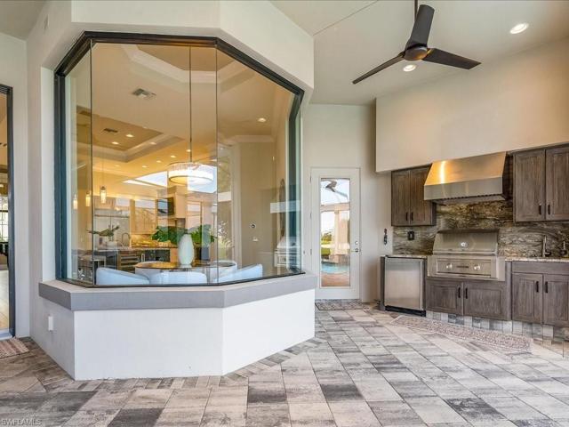 Summer kitchen with fridge, gas grill and plenty of storage