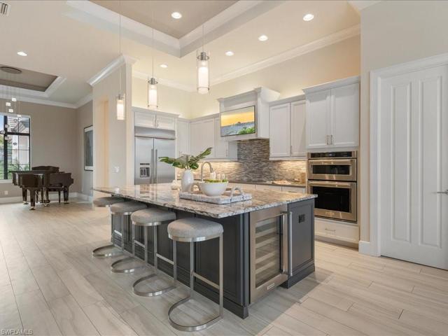 Island has storage and a wine fridge, spacious pantry completed this kitchen