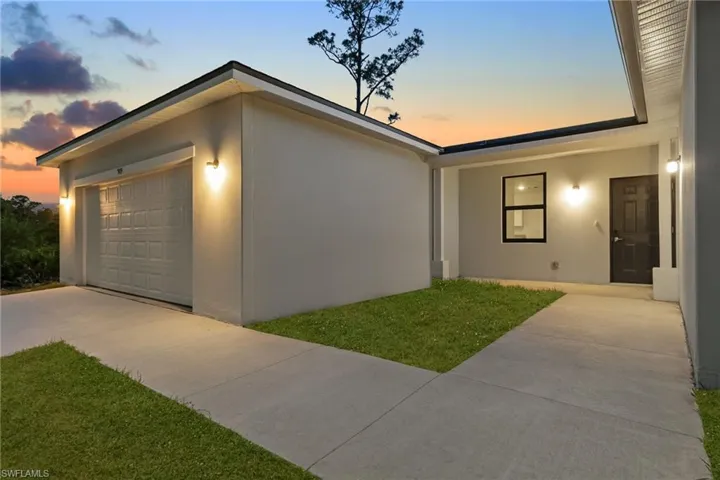 View of front of house with stucco siding