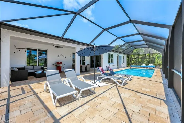 Huge lounge area, a patio area, ceiling fan, and screen enclosure