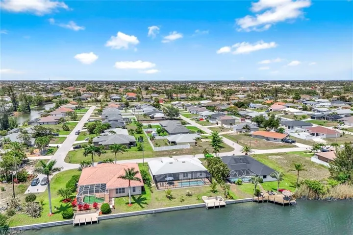 Aerial view of residential area with a large body of water