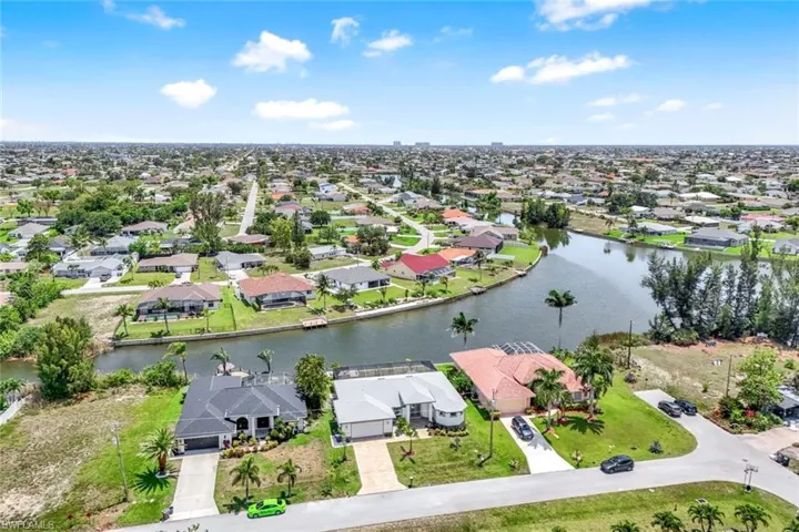 Aerial perspective of suburban area with a large body of water