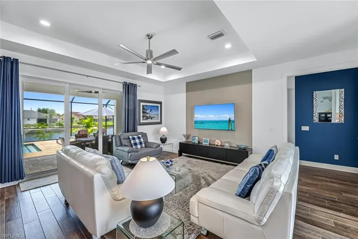Tastefully furnished living room with large TV