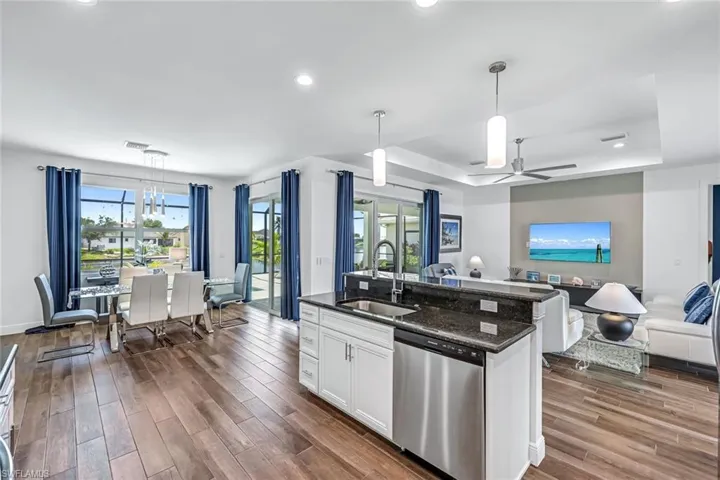 Kitchen featuring dishwasher, granite counter-top, open floor plan