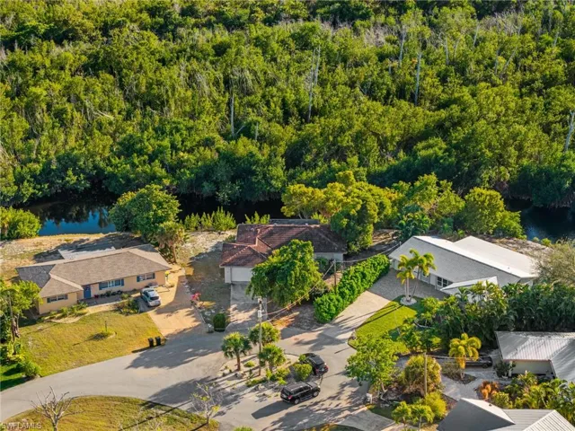 Aerial overview of property's location featuring a large body of water