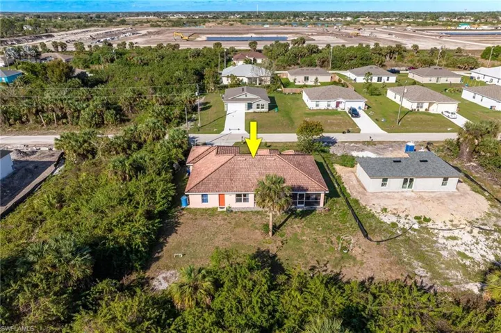 Birds eye view of property with a residential view