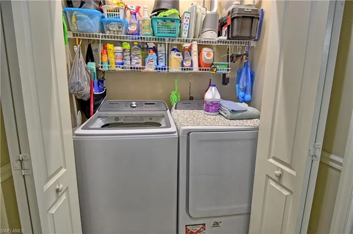 Clothes washing area featuring washer and clothes dryer