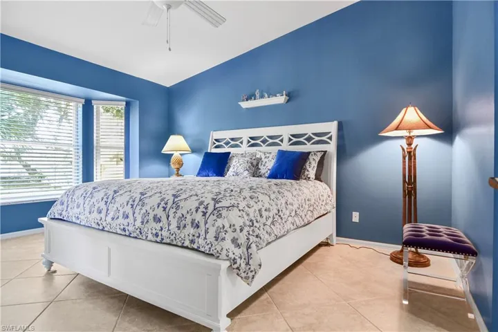 Primary bedroom with views of the water and golf course