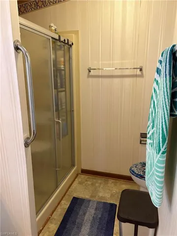 Bathroom with a shower with door