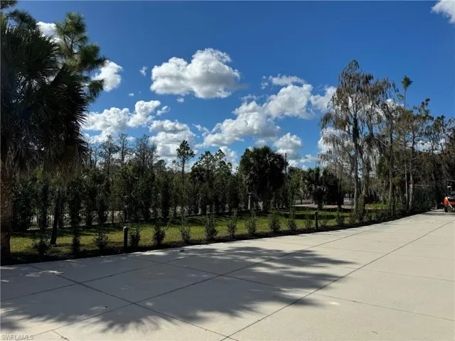 Driveway at front of home inside of gate