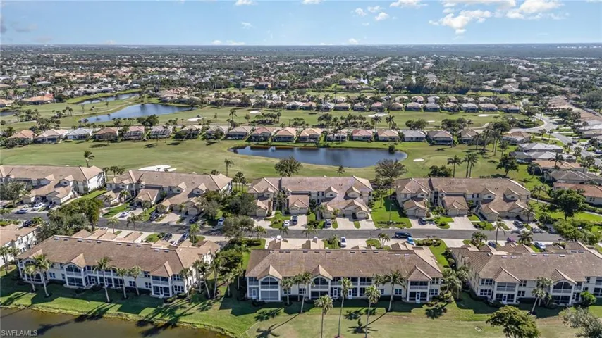 Birds eye view of property with a water view, a residential view, and golf course view