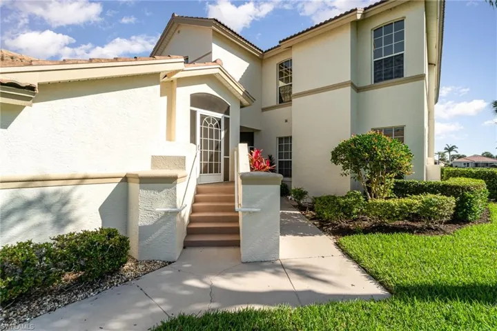 Property entrance with stucco siding