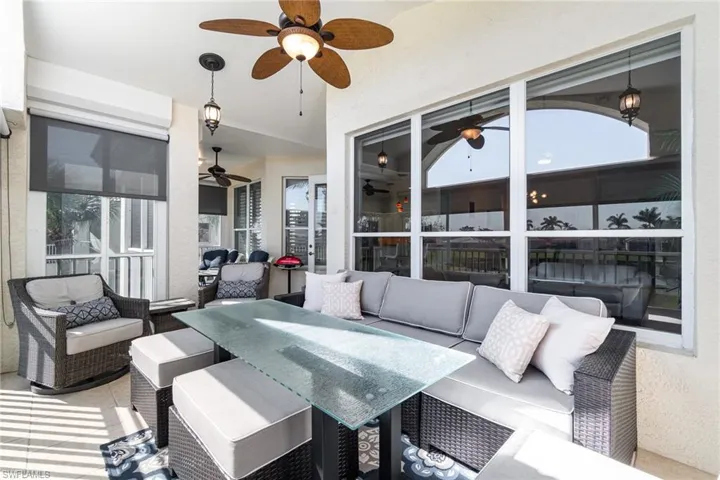 Sunroom / solarium with a ceiling fan