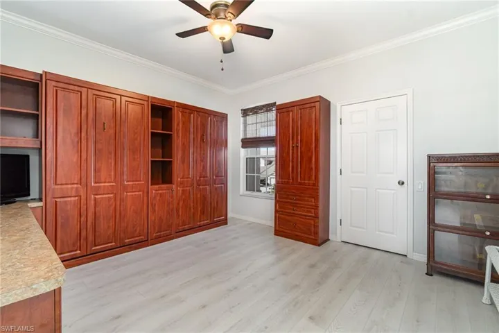 3rd bedroom with desk, walk in closet and two pull down murphy beds