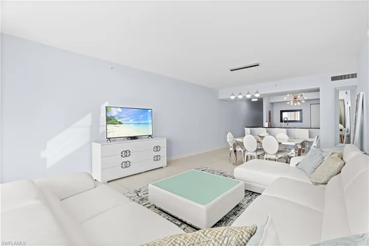 Living room featuring baseboards and tile patterned floors