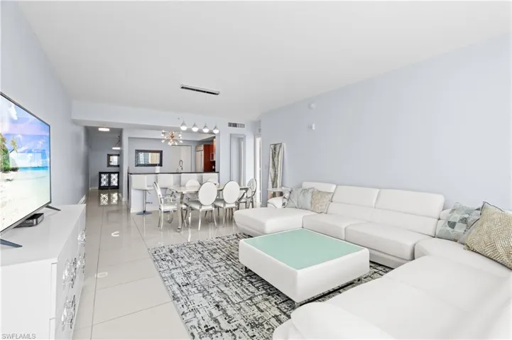 Living area featuring light tile patterned floors