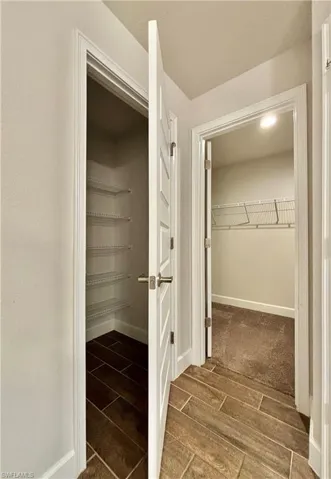 Master bedroom with double closet with one eing walk in closet