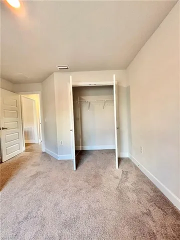 Bedroom # 3 featuring a closet, carpet floors