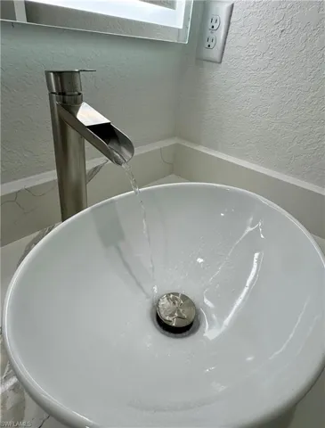 Bathroom view of a textured wall and a garden tub