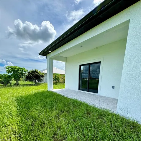 Back of property featuring a patio area and stucco siding