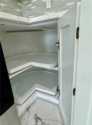 Bathroom with light marble finish floors