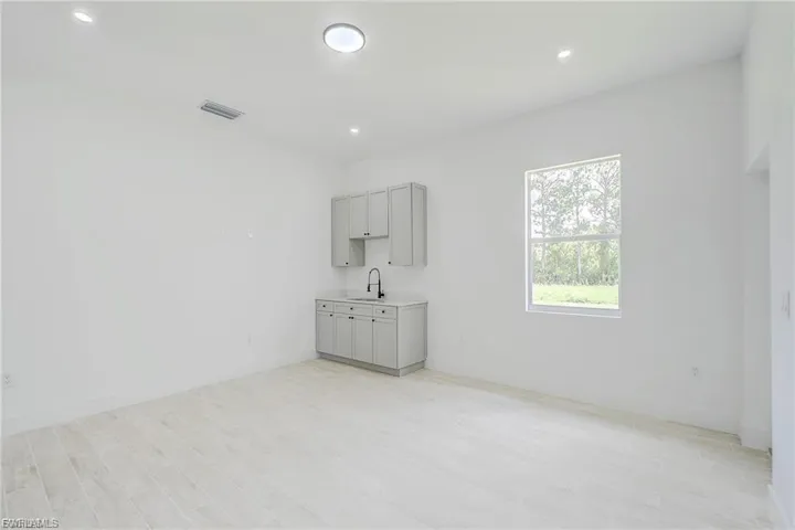 Unfurnished room with light wood finished floors and recessed lighting