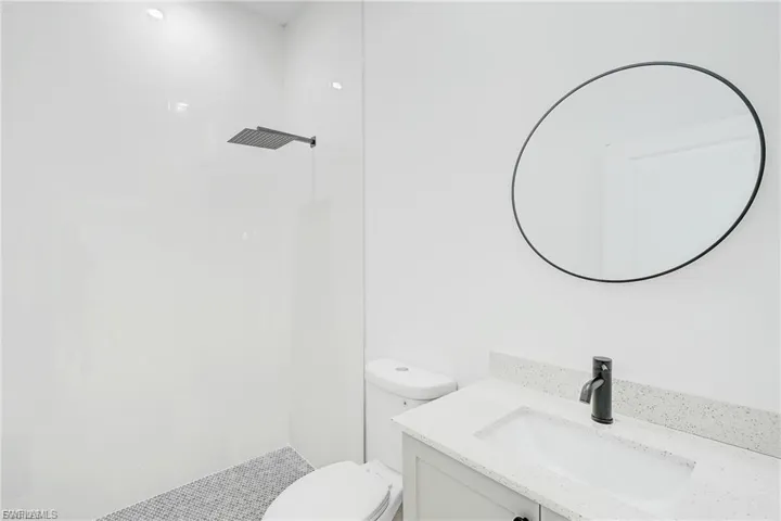 Full bathroom featuring vanity and a tile shower