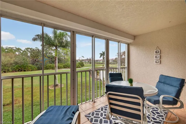 Sunroom with view of golf course