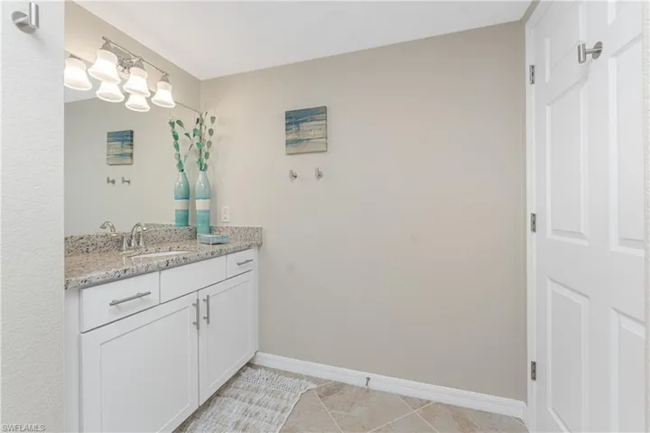 Bathroom featuring vanity and light tile patterned flooring