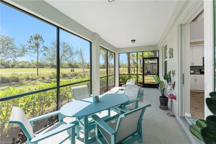 Sunroom / solarium with outdoor dining area