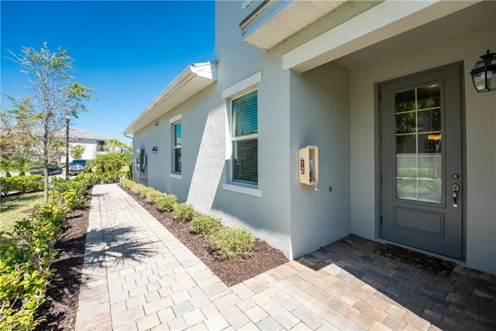 View of property exterior with stucco siding