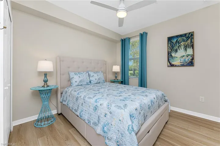 Bedroom featuring light wood-type flooring and a ceiling fan