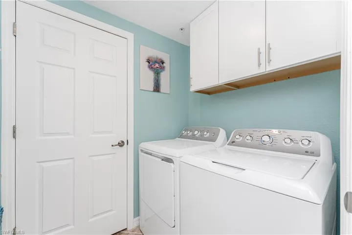 Laundry area with washer and dryer and cabinet space