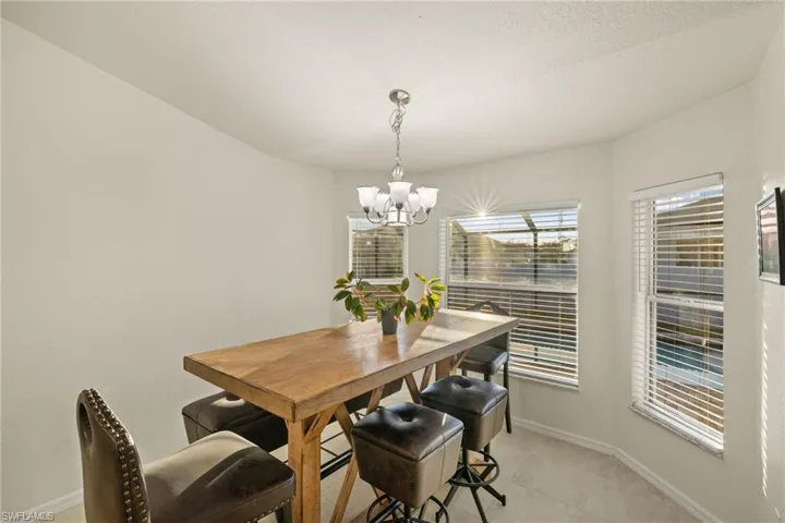 Breakfast nook with chandelier & view of pool