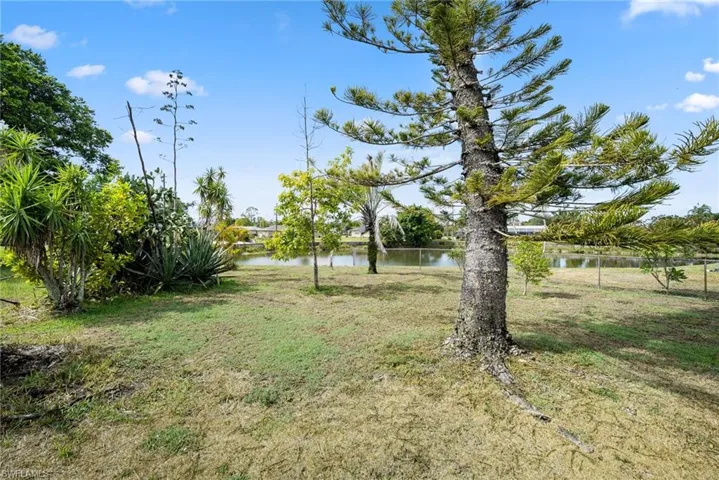 View of yard with a water view