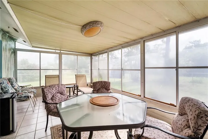 Sunroom with wood ceiling