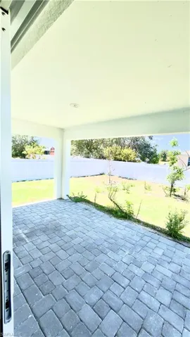 Covered patio with paver flooring and recessed lighting