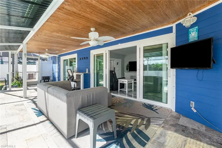 Undercover lanai can be used as an extended family room - mounted TV will stay with home