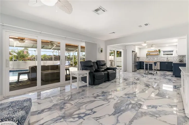 Spacious, open floor plan that easily brings the outside in. Interior has elegant "water-flowing" tile throughout the entire home.