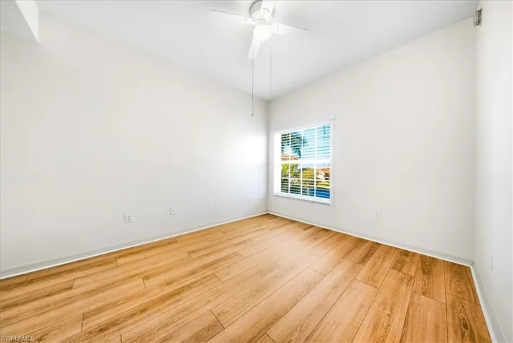 Unfurnished room with light wood-style flooring and a ceiling fan