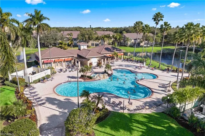 Community pool featuring a patio