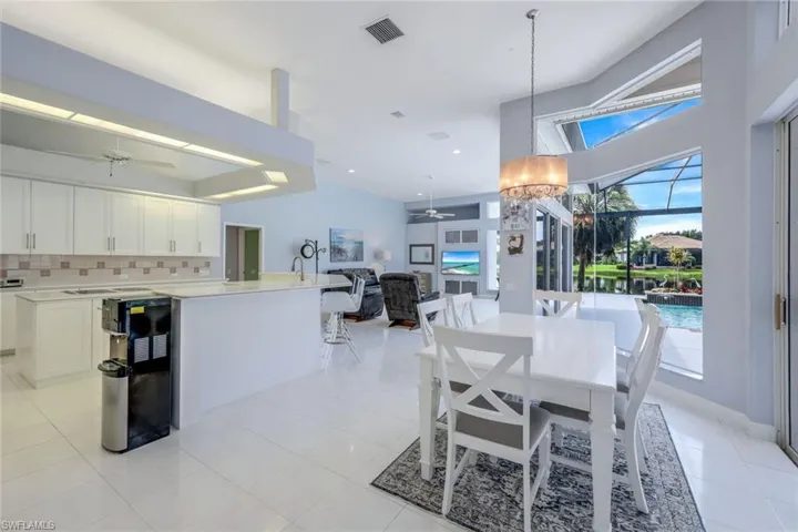 Dining room featuring light tile flooring and ceiling fan