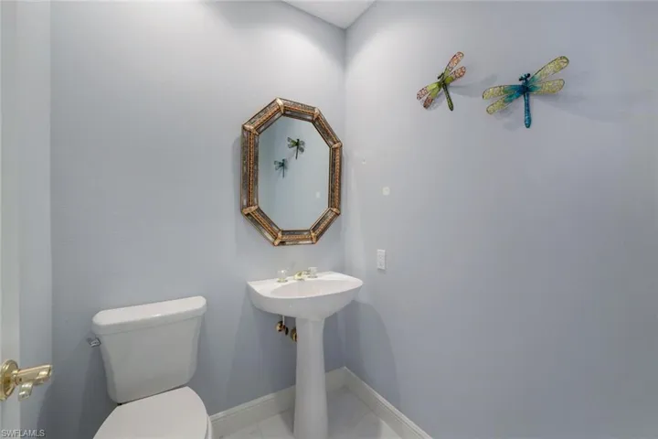 Bathroom with tile flooring and toilet