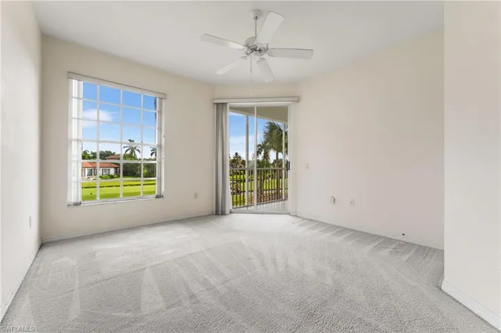 Primary bedroom has access to your lanai and views of the golf course and lake!