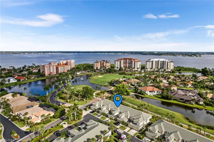 Aerial view featuring a water view and golf course views.