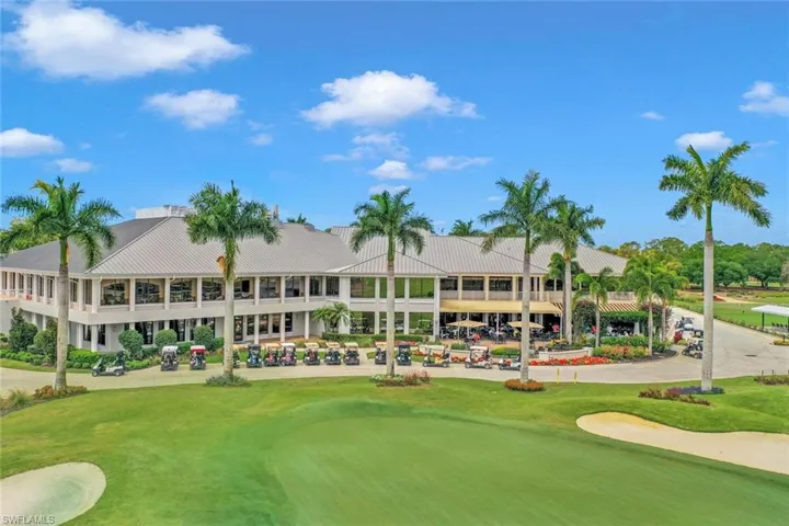 Surrounding community with golf course view and a yard