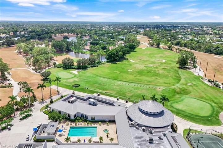 Aerial view of a nearby body of water and a local golf course