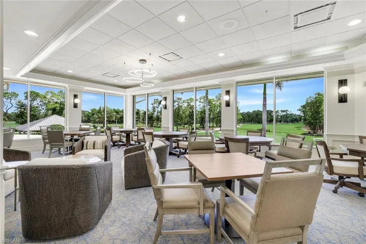 Dining area with carpet floors, plenty of natural light, view of golf course, and recessed lighting